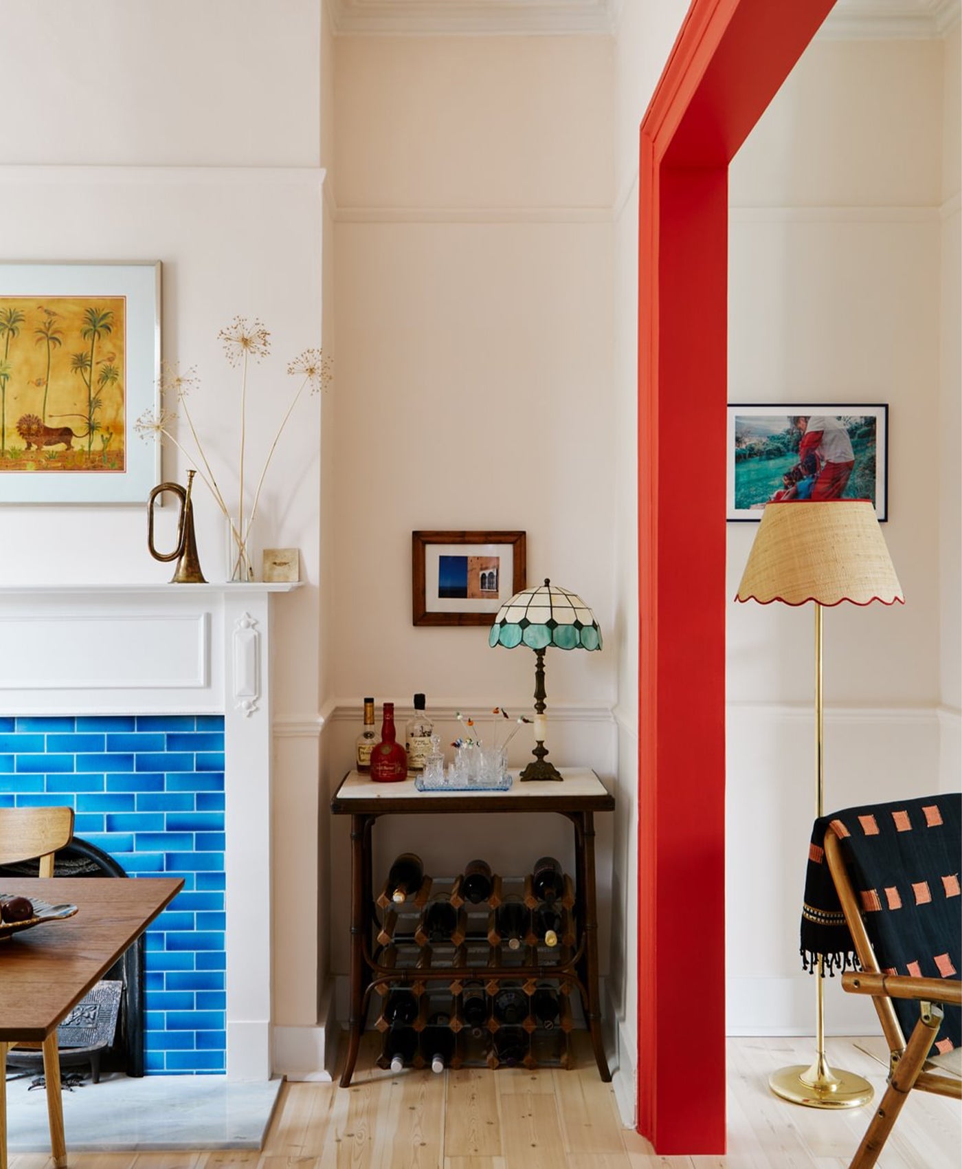 Modern interior with a fireplace, table, and decorative items.