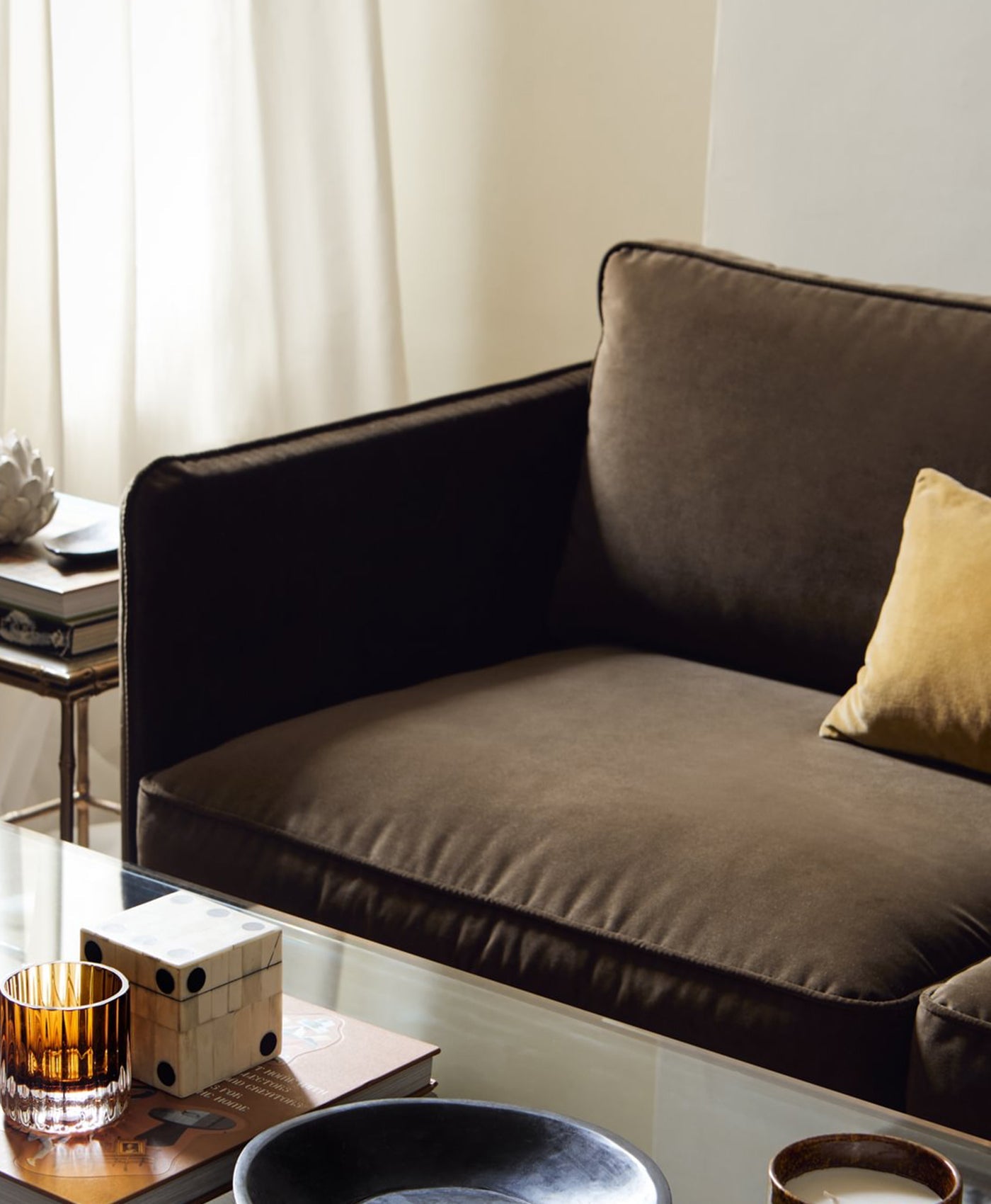 Brown sofa in neutral coloured living room