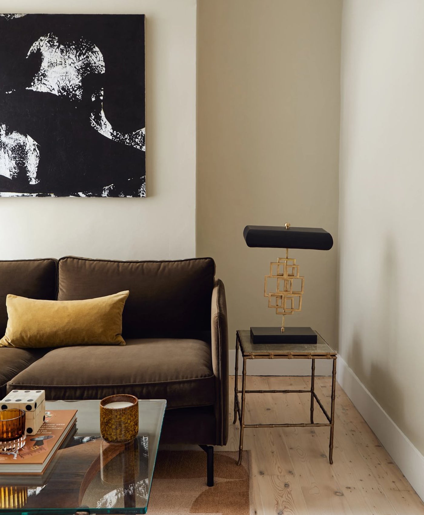 Olive neutral living room with brown sofa, and pale wood flooring