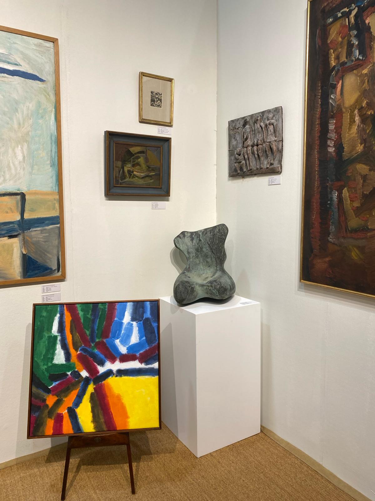 Art gallery with various paintings and sculptures on display