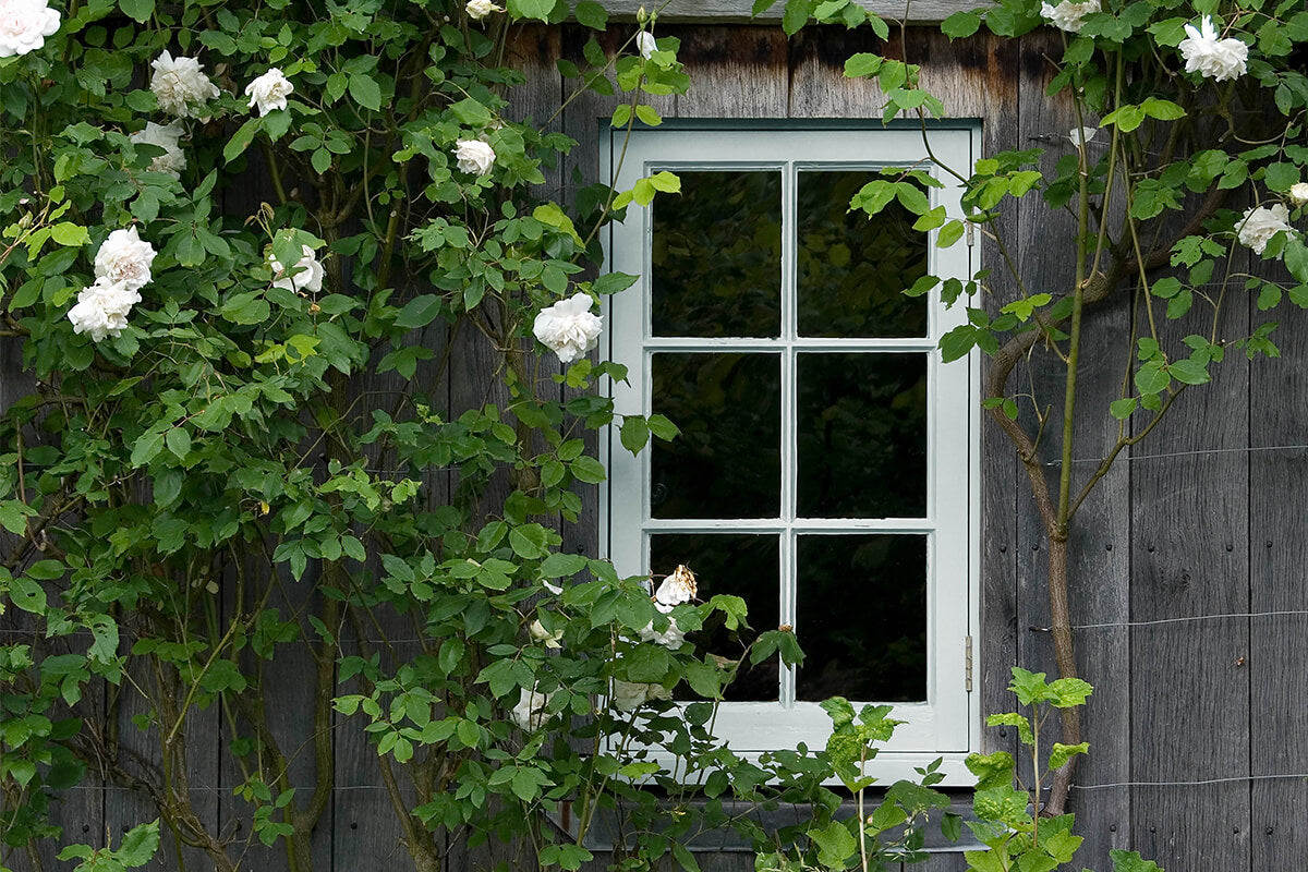 A wooden window frame painted with Grail JB02 coloured paint 