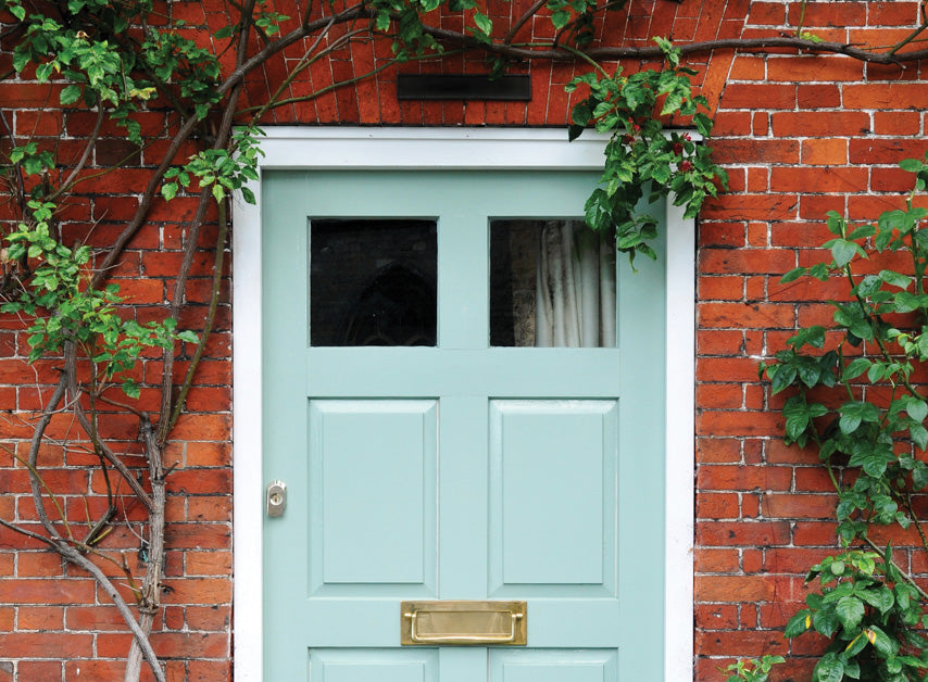 A pale blue grey door painted with Beaufort Gardens No.212